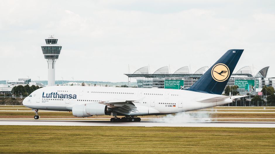 Lufthansa Airbus A380 landing at Munich Airport, showcasing aviation dynamics.